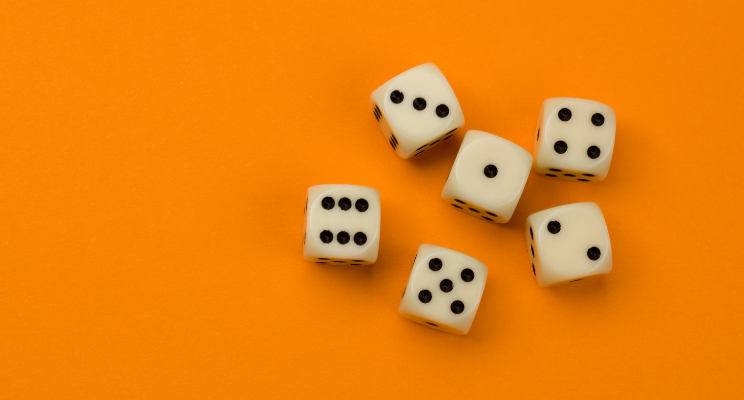 dice against an orange background